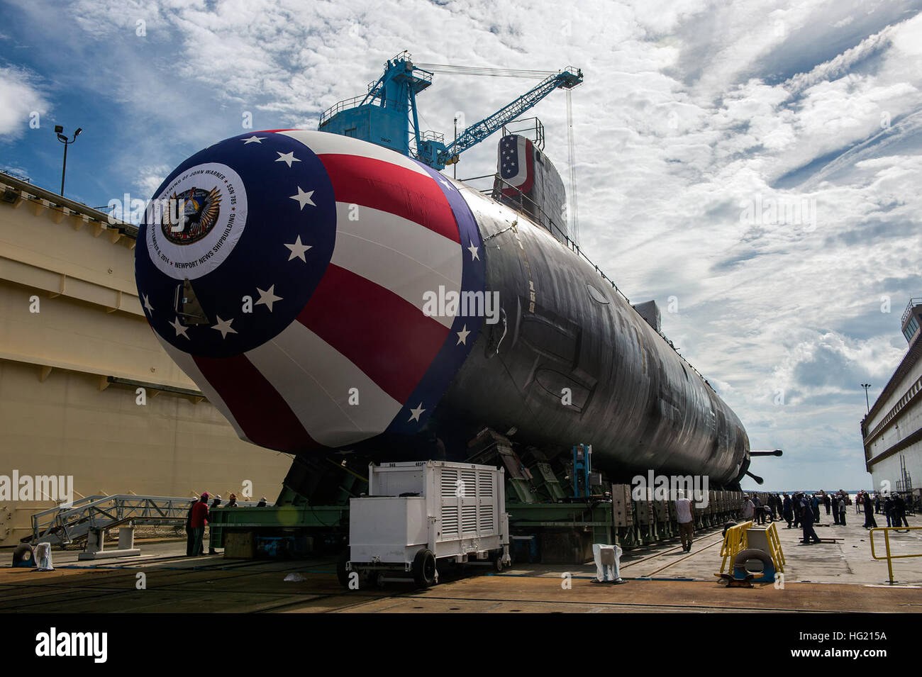 140831-N-ZZ999-077 NEWPORT NEWS, Va. (Sept. 1, 2014) The Virginia-class attack submarine  Pre-commissioning unit (PCU) John Warner (SSN 785) is moved to Newport News Shipbuilding’s floating dry dock in preparation for the Sept. 6 christening. A team of shipbuilders spent about eight hours to move the submarine from the facility where it was assembled to the dock. (U.S. Navy photo courtesy of Huntington Ingalls Industries by John Whalen/Released) USS John Warner (SSN 785) is moved to Newport News Shipbuilding's floating dry dock Stock Photo