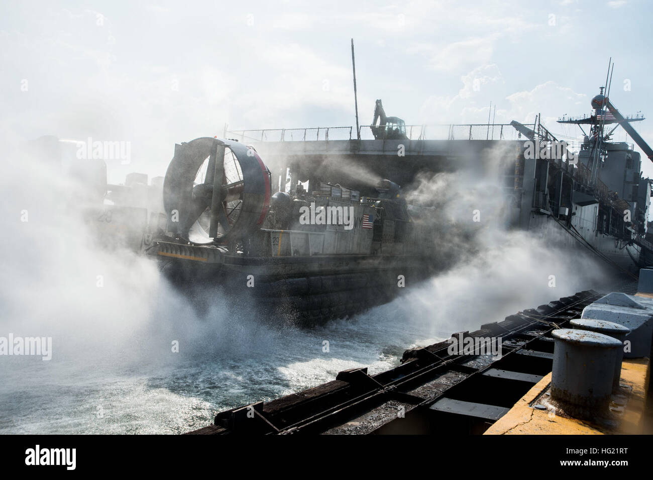 Landing Craft Air Cushion (LCAC) 29, assigned to Naval Beach Unit (NBU) 7, embarks the amphibious dock landing ship USS Germantown (LSD 42) during an equipment offload while taking part in the Amphibious Landing Exercise 2015 (PHIBLEX15). PHIBLEX15 is an annual bilateral training exercise conducted with the Armed Forces of the Philippines. Germantown is part of the Peleliu Expeditionary Strike Group, commanded by Rear Adm. Hugh Wetherald, and is conducting joint forces exercises in the U.S. 7th Fleet area of responsibility. (U.S. Navy photo by Mass Communication Specialist Seaman Apprentice Pa Stock Photo