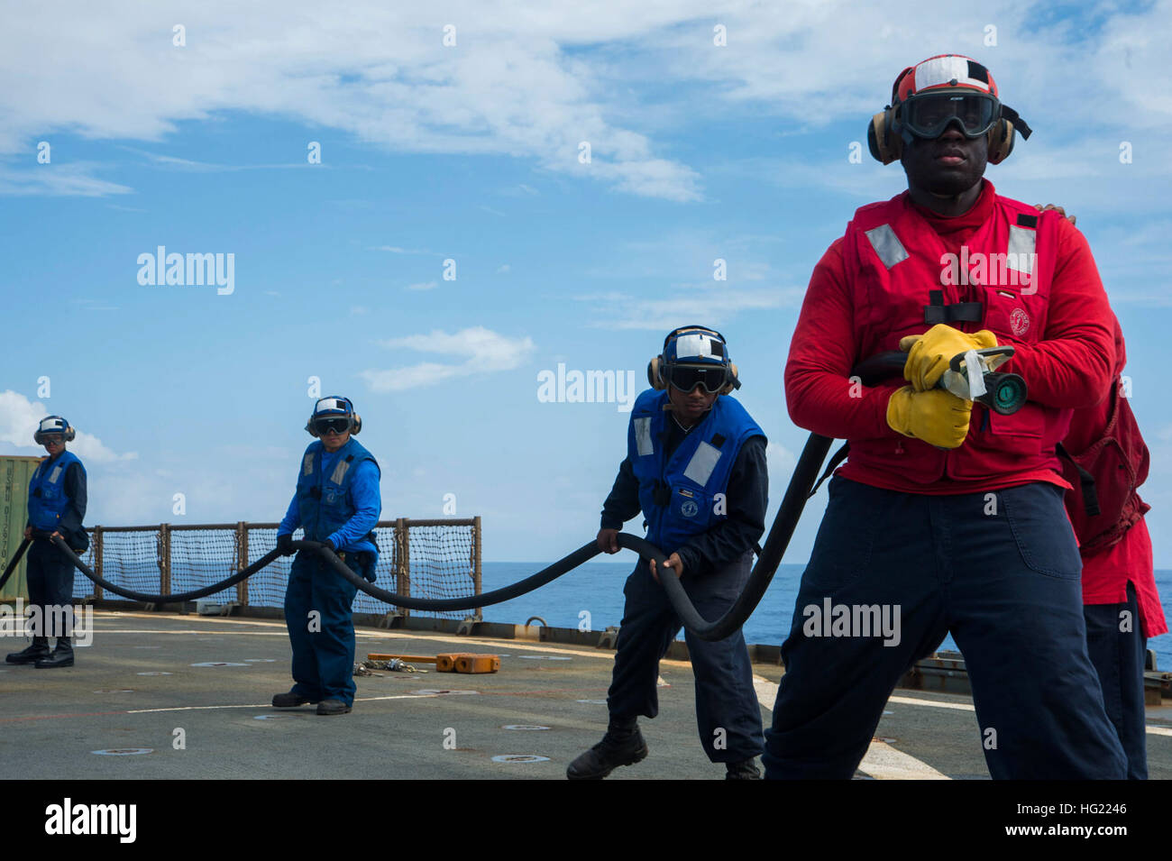Sailors participate in a flight deck fire fighting drill aboard the