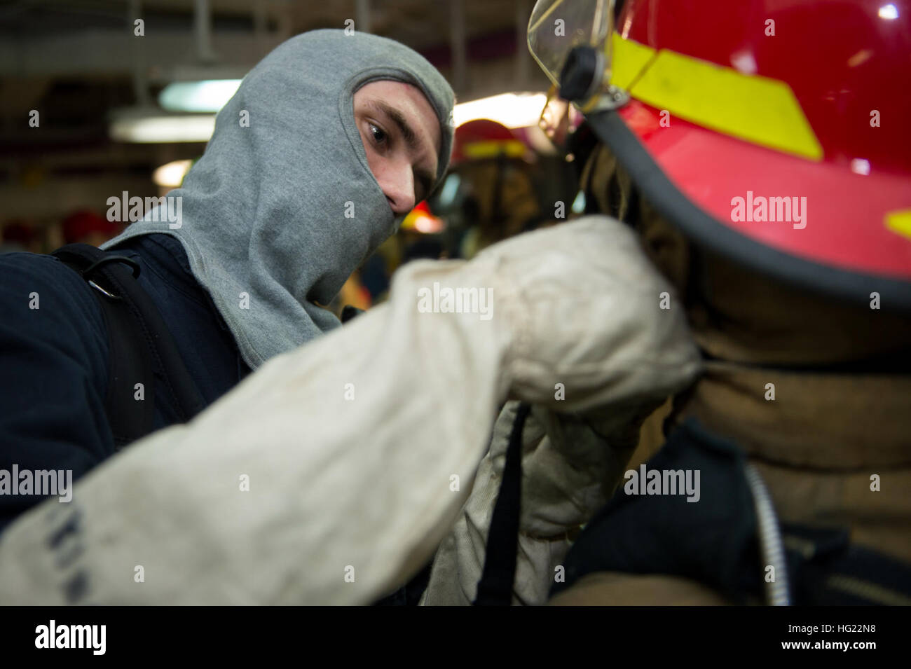 Machinist’s Mate Fireman Apprentice Aaron Skinner Helps A Sailor Don ...