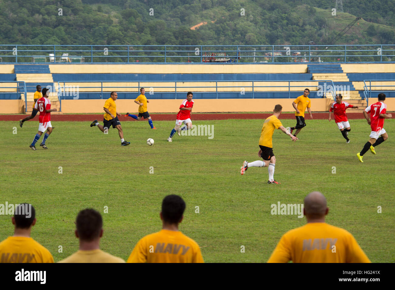 Sailors and Marines assigned to the dock landing ship USS Comstock (LSD 45) and 11th Marine Expeditionary Unit (MEU) play a game of soccer against the Royal Malaysian Navy during a port visit. Comstock, part of the Makin Island Amphibious Ready Group, is on a deployment with the 11th MEU to promote peace and freedom of the seas by providing security and stability in the U.S. 7th Fleet area of operations. (U.S. Navy photo by Mass Communication Specialist 3rd Class Lenny LaCrosse/Released) USS Comstock Sailors, 11th MEU Marines play soccer with Royal Malaysian Navy 150127-N-CU914-425 Stock Photo