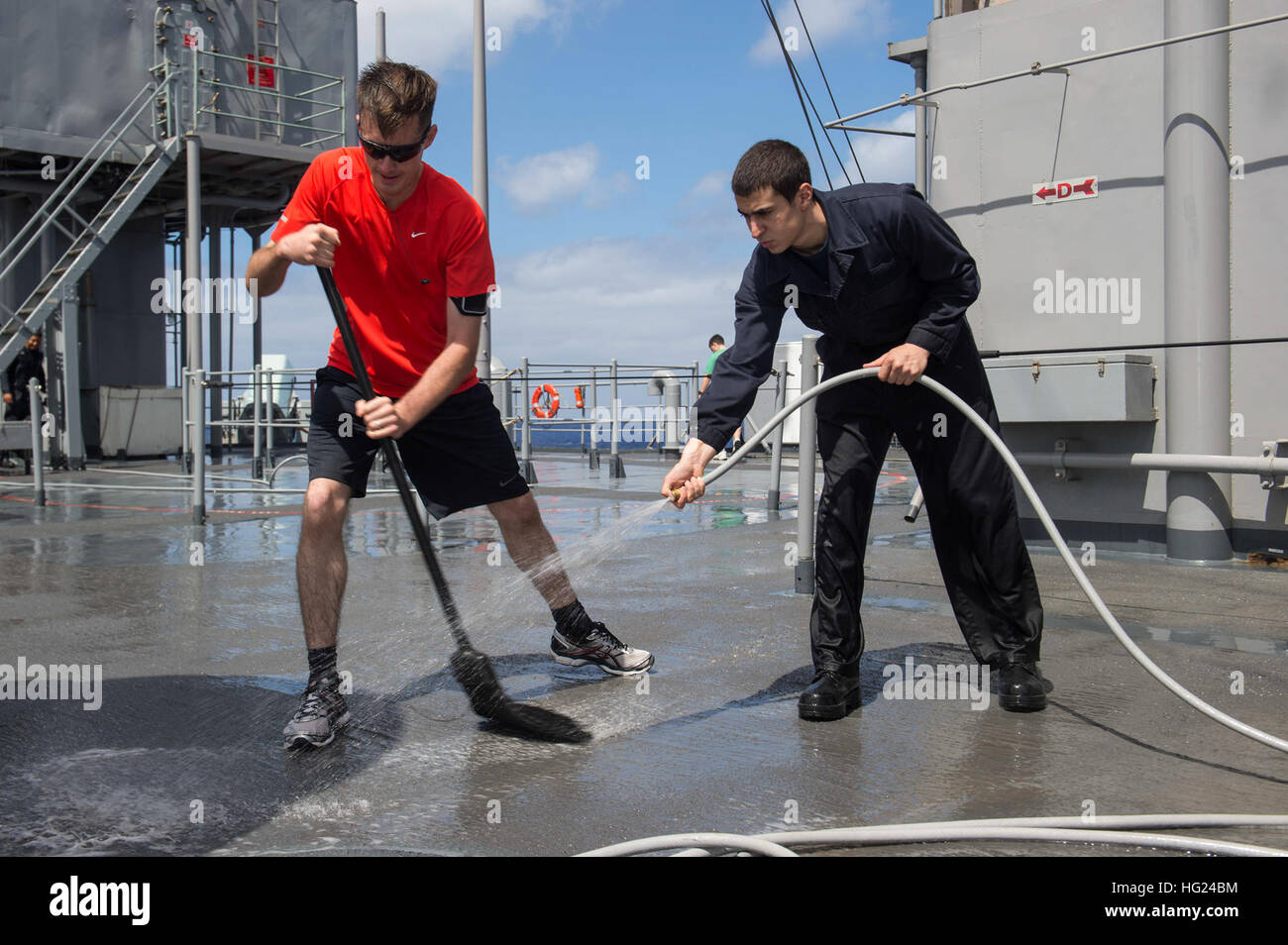 150210-N-CU914-090   PACIFIC OCEAN (Feb. 10, 2015) – Fire Controlman 1st Class Greggory A. Clark, left, from Roseville, Calif., and Cryptological Technician (Technical) Seaman Apprentice Scott J. Ferer, from Buffalo, N.Y., scrub the deck aboard the dock landing ship USS Comstock (LSD 45) during a fresh-water wash-down. Comstock, part of the Makin Island Amphibious Ready Group, and the embarked 11th Marine Expeditionary Unit are returning to homeport San Diego following a seven-month deployment to the Western Pacific and the U.S. Central Command areas of operation. (U.S. Navy photo by Mass Comm Stock Photo
