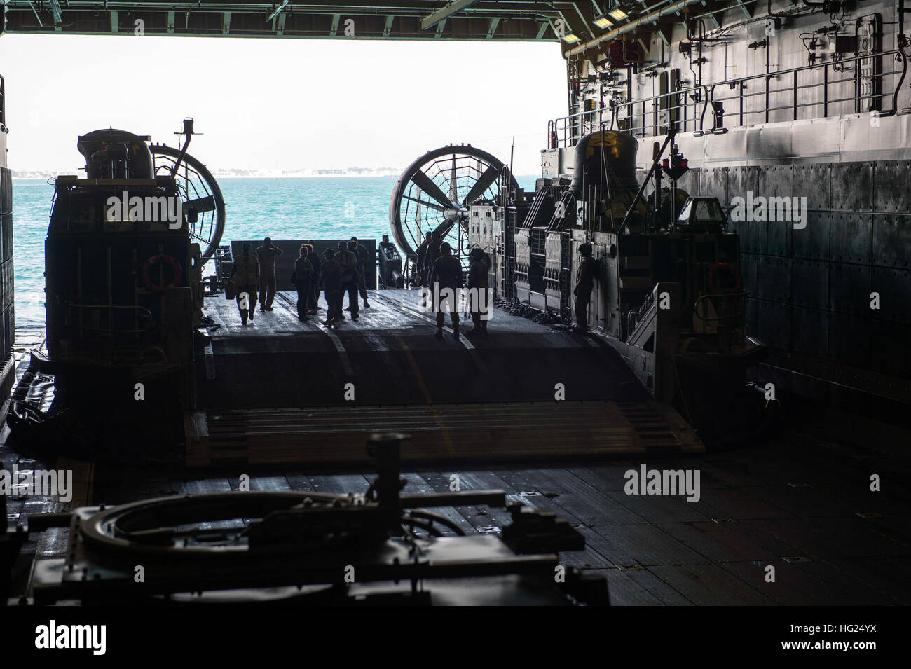 150301-N-XG464-183 -ARABIAN GULF (March 1, 2015) - Distinguished visitors prepare to debark from the amphibious transport dock ship USS New York (LPD 21) on a Landing Craft Air Cushion (LCAC) upon completion of a disguised-visitors tour. New York is a part of the Iwo Jima Amphibious Ready Group (ARG) and, with the embarked 24th Marine Expeditionary Unit (MEU), is deployed in support of maritime security operations and theater security cooperation efforts in the U.S. 5th Fleet area of operations. (U.S. Navy photo by Mass Communication Specialist 3rd Class Jonathan B. Trejo/Released) USS New Yor Stock Photo