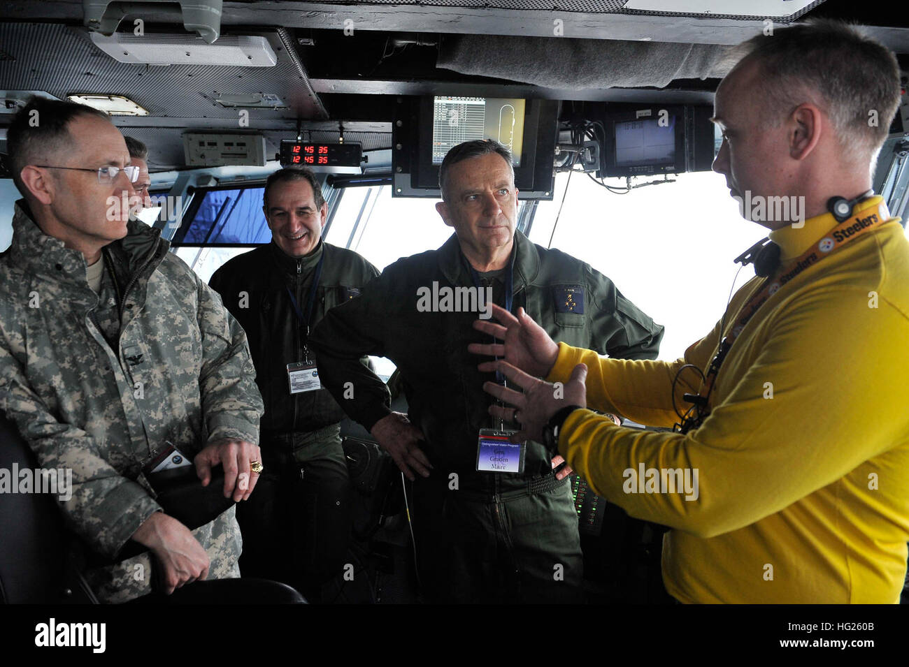 150328-N-GR120-271 ATLANTIC OCEAN (March 28, 2015) – Cmdr. Brian Beck, Air  Boss of the Nimitz-class aircraft carrier USS Theodore Roosevelt (CVN 71)  speaks to Gen. Gratien Maire, Deputy Chief of Staff of