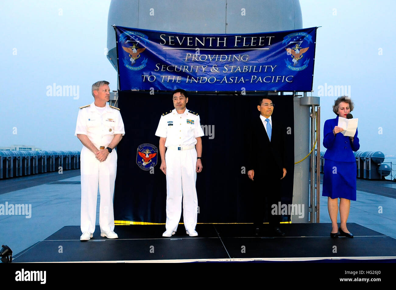 150421-GR655-N-190 ZHANJIANG, People’s Republic of China (April 21, 2015) – Jennifer Galt, U.S. Consulate General, Guangzhou, right, delivers remarks alongside Wang Zhongbing, mayor of Zhanjiang, right center; People’s Liberation Army Navy PLA(N) Vice Adm. Shen Jinlong, commander, South Sea Fleet; and U.S. Navy Vice Adm. Robert L. Thomas Jr., commander, U.S. 7th Fleet during a reception aboard the U.S. 7th Fleet flagship USS Blue Ridge (LCC-19) April 21, 2015. Blue Ridge is conducting a port visit to Zhanjiang to build naval partnerships with China’s South Sea Fleet to ensure peace and prosper Stock Photo