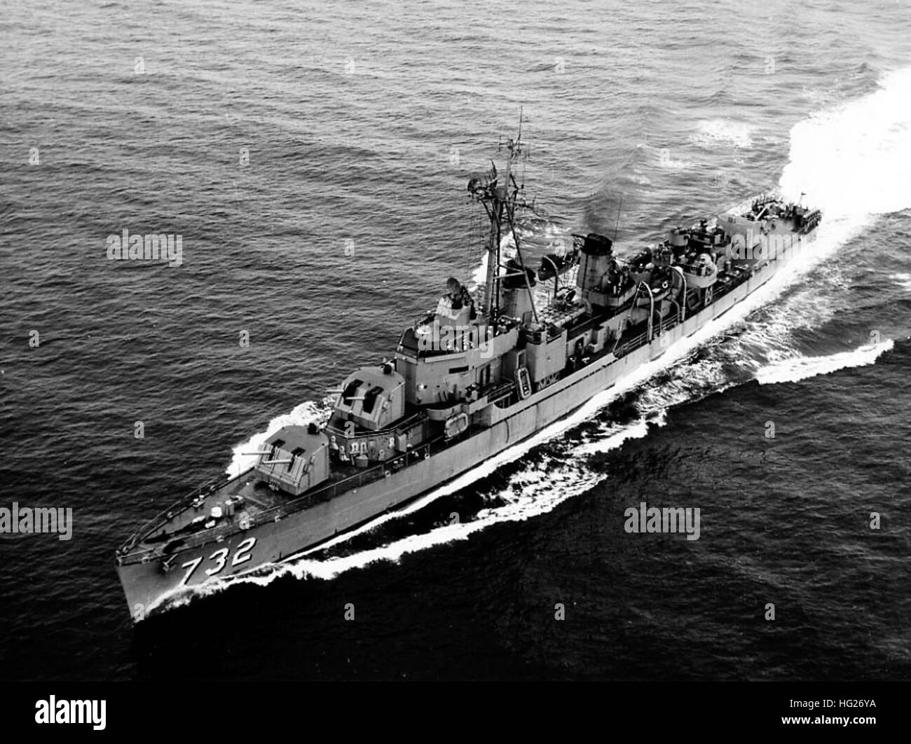 USS Hyman (DD-732) underway during the early or middle 1950s. This photograph was received by the Naval Photographic Center in December 1959, but was taken several years earlier. Note that the ship still carries 40mm guns (replaced by 3/50s by mid-decade) and 20mm guns, but has a tripod foremast and SPS-6 radar (both typically fitted during the early '50s).  Official U.S. Navy Photograph, from the collections of the Naval History and Heritage Command. USS Hyman (DD-732) underway in the early 1950s Stock Photo