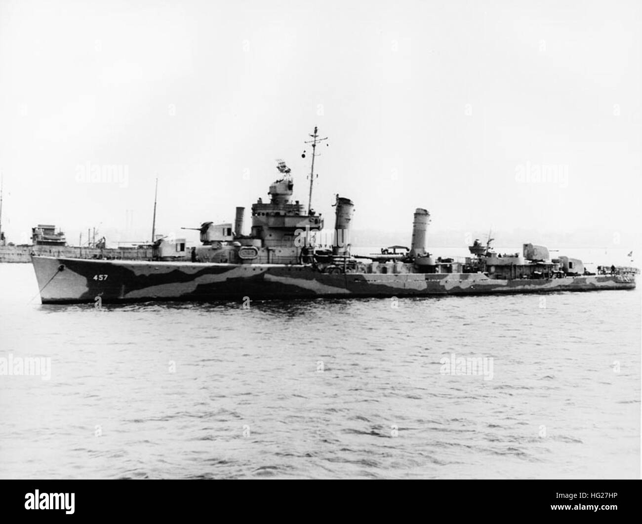 USS Emmons (DD-457) at anchor, circa 1942. The ship is painted in ...