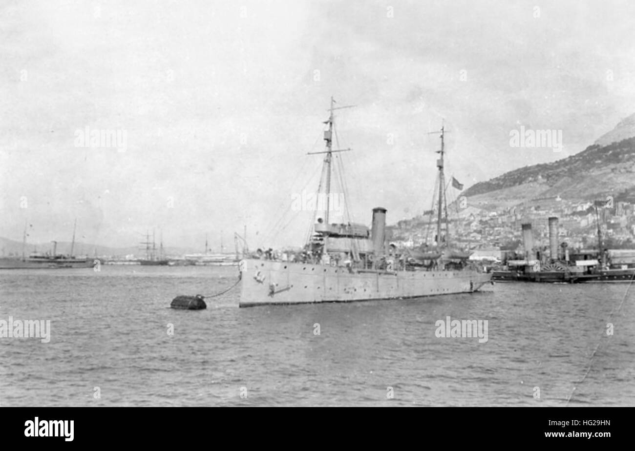 USCGC Tampa (Coast Guard Cutter, 1912) moored in a European port (possibly Gibraltar), circa 1917-1918. This ship torpedoed and sunk on 26 September 1918, with the loss of all 131 persons on board. The original image is printed on post card stock. Note the paddle tug astern of Tampa and the large converted yacht in the left distance. The latter may be a British Navy vessel.   Donation of Charles R. Haberlein Jr., 2009.     U.S. Naval History and Heritage Command Photograph. USCGC Tampa in port c1918 Stock Photo