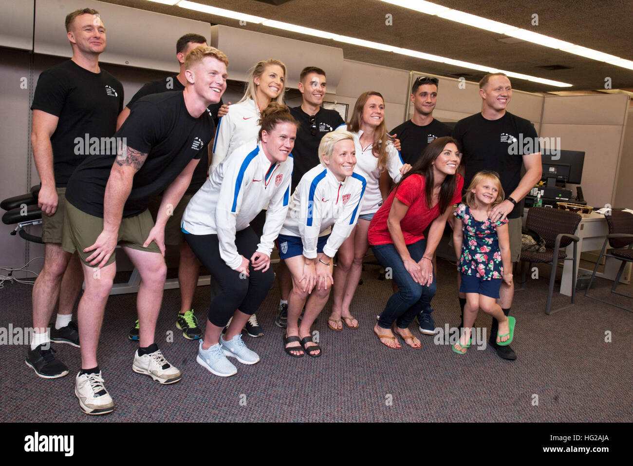 U.S. Women’s National Soccer Team athletes visited the Makalapa Clinic on Joint Base Pearl Harbor-Hickam to thank Wounded Warriors for their service. The USWNT will play Trinidad & Tobago on Dec. 5 at Aloha Stadium in Hawaii as part of their Victory Tour. Several events will take place leading up to the 74th anniversary of Pearl Harbor Day to pay tribute to the nation’s military while enlightening Americans about veterans and service. (U.S. Navy photo by Mass Communication Specialist 2nd Jerome D. Johnson/Released) USWNT players pose at Pearl Harbor-Hickham 151203-N-TE668-077 Stock Photo