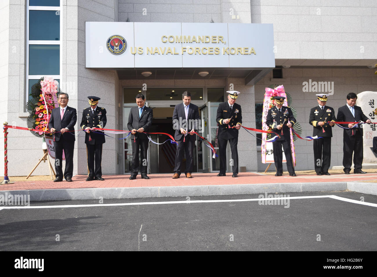 160219-N-WT427-291 BUSAN, Republic of Korea (Feb. 19 2016) -  Rear. Adm. Bill Byrne, commander U.S. Naval Forces Korea (CNFK), Gen. Curtis Scaparrotti,  commander, U.S. Forces Korea, VAdm. Ki-sik Lee, commander Republic of Korea (ROK) Fleet, Maj. Gen. James Walton, director of transformation and re-stationing for U.S. Forces Korea, Hon. Mark Lippert, U.S. ambassador to the ROK, Jung Gyung-jin, mayor of Busan for administrative affairs and Lee Jong-cheol, Nam-gu district mayor cut the ribbon of CNFK's new head quarters building during a ribbon-cutting ceremony. This ceremony marks the opening o Stock Photo