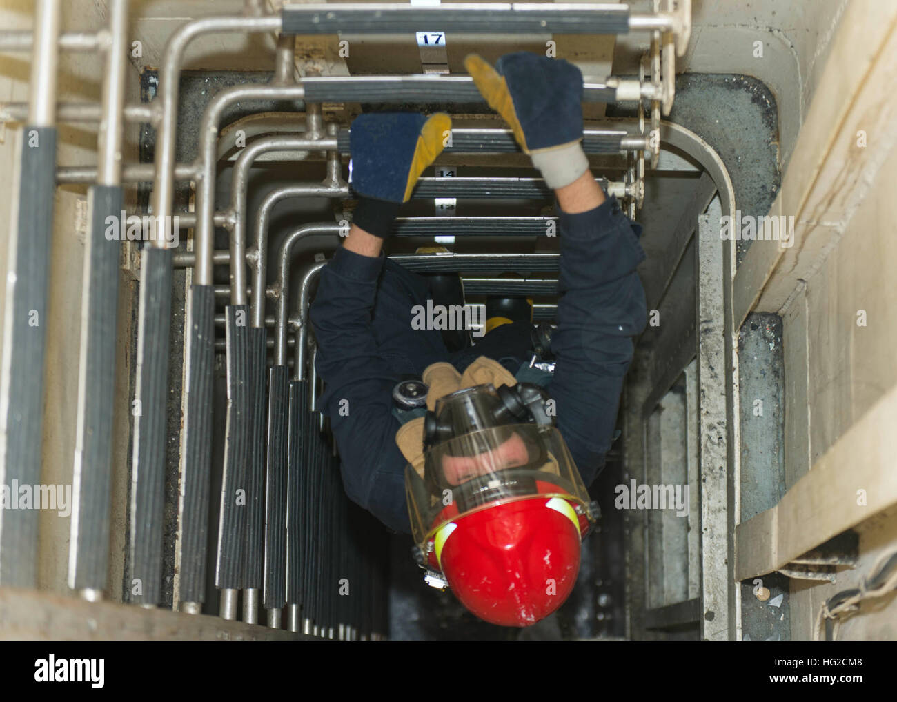 160705-N-GP524-248 ARABIAN GULF (July 5, 2016) Boatswain’s Mate 2nd Class Kevin Greider climbs up a ladder well during a general quarters training exercise aboard the guided-missile destroyer USS Stout (DDG 55). Stout, deployed as part of the Eisenhower Carrier Strike Group, is supporting maritime security operations and theater security operations in the U.S. 5th Fleet area of operations. (U.S. Navy photo by Mass Communication Specialist 3rd Class Bill Dodge/Released) USS STOUT (DDG 55) DEPLOYMENT 2016 160705-N-GP524-248 Stock Photo