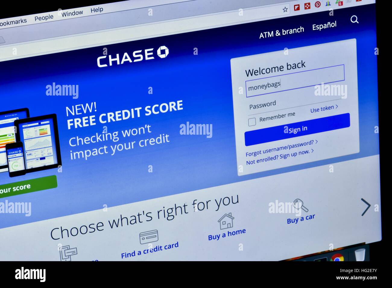An Apple Macbook Pro displayed on a marble surface while displaying the Chase bank website Stock Photo