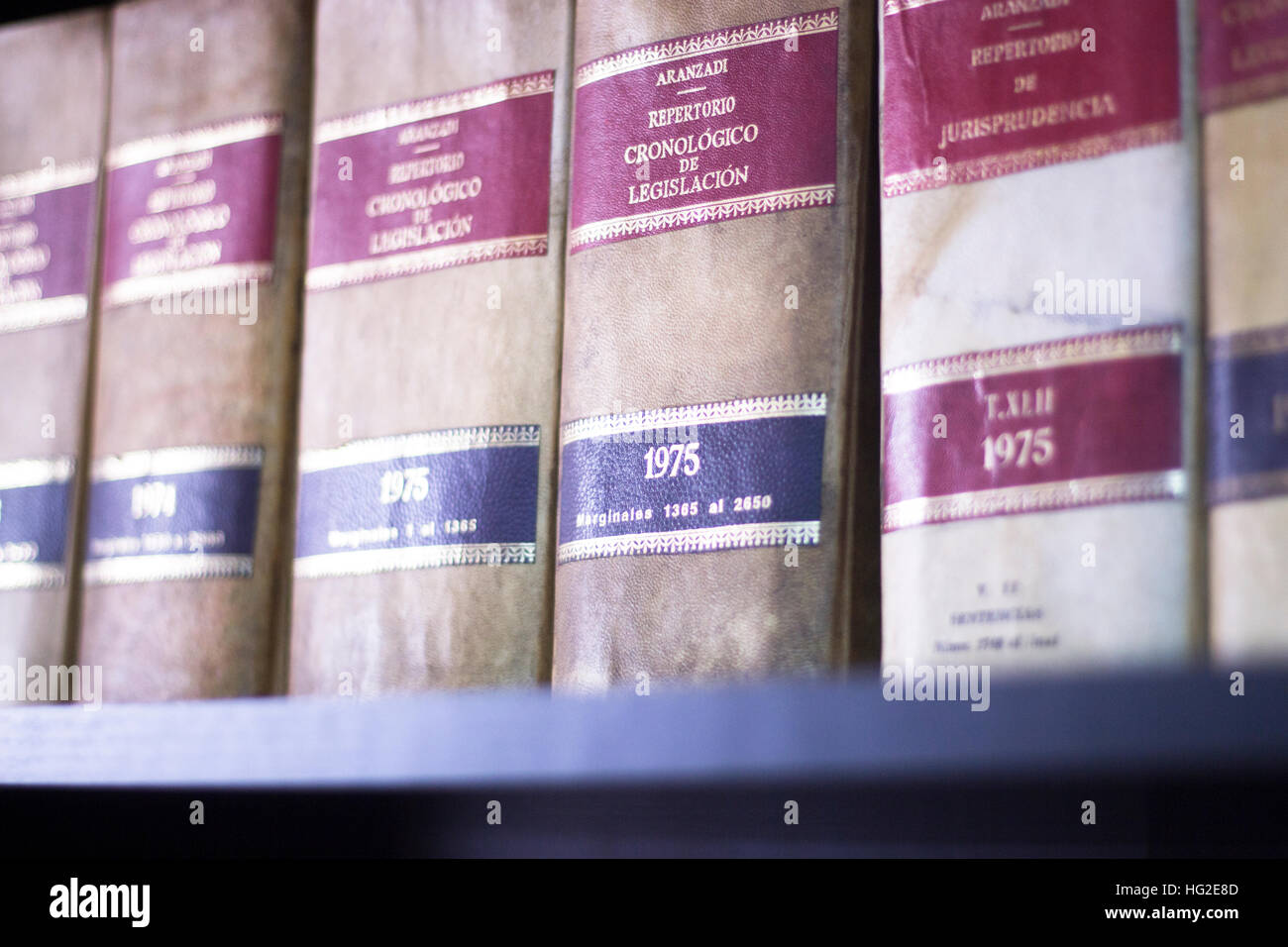 Old legal books law reports on shelves of law offices of attorneys and lawyers in judicial reference library. Stock Photo