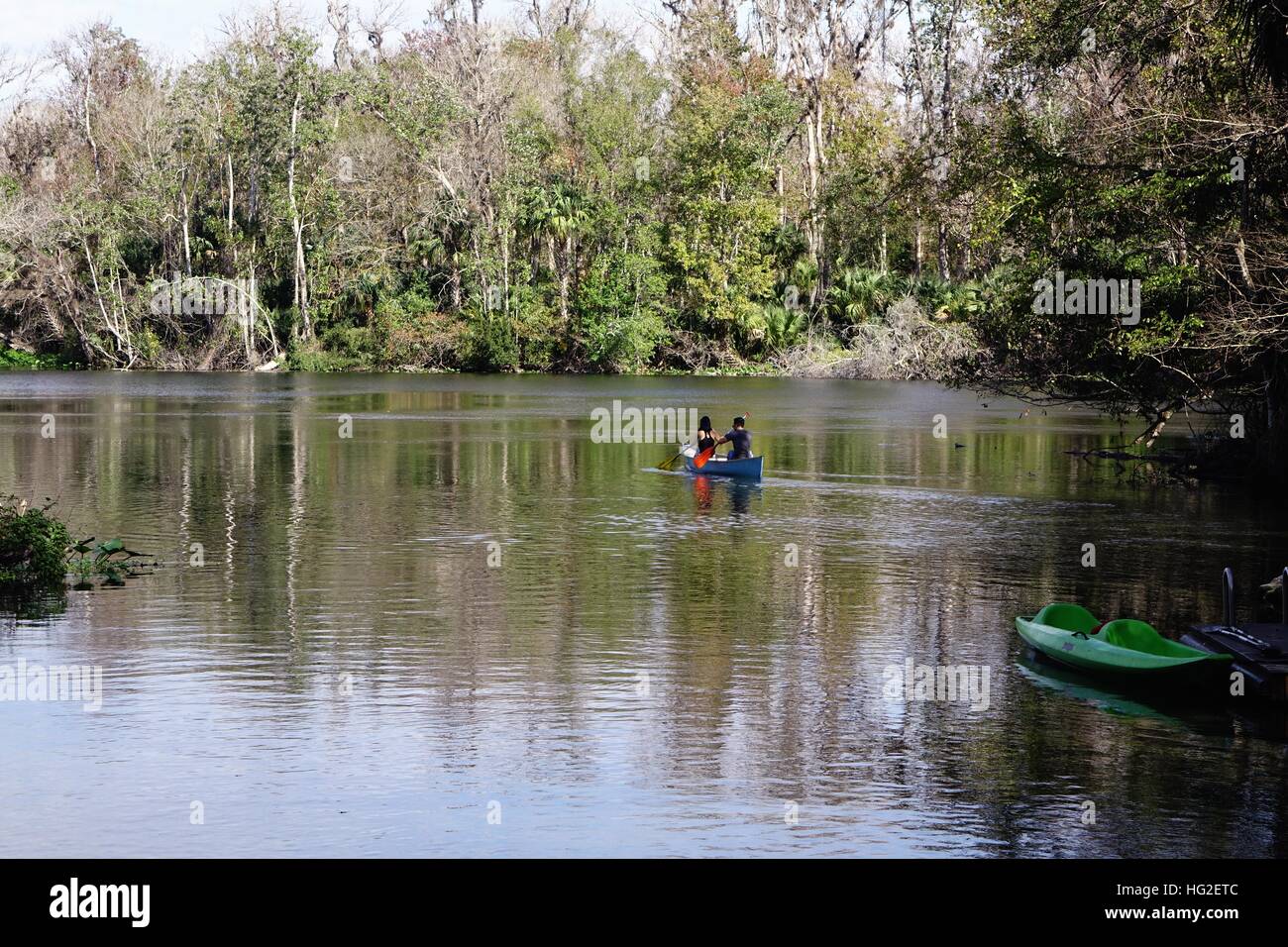 Couple paddling a canoe at Wekiwa Springs State Park, Apopka, Florida
