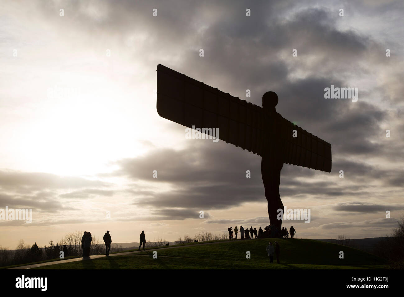 People visit the Angel of the North in Gateshead, England. The sculpture, designed by artist Antony Gormley, was unveiled in 1998. Stock Photo