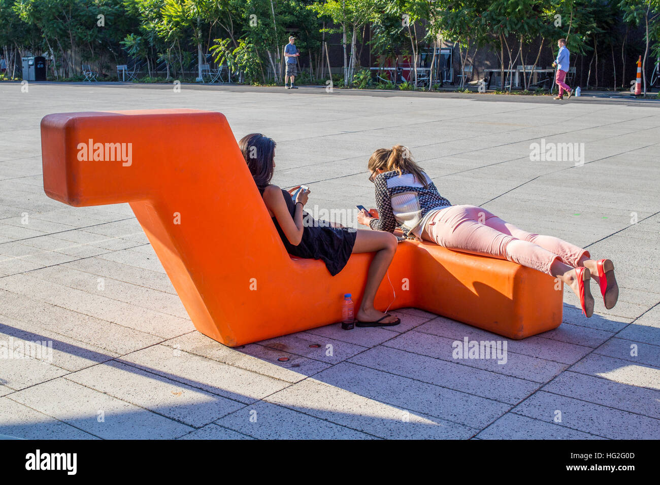 Two student relaxing in Harvard SquareHarvard Square, Cambridge, Massachusetts Stock Photo