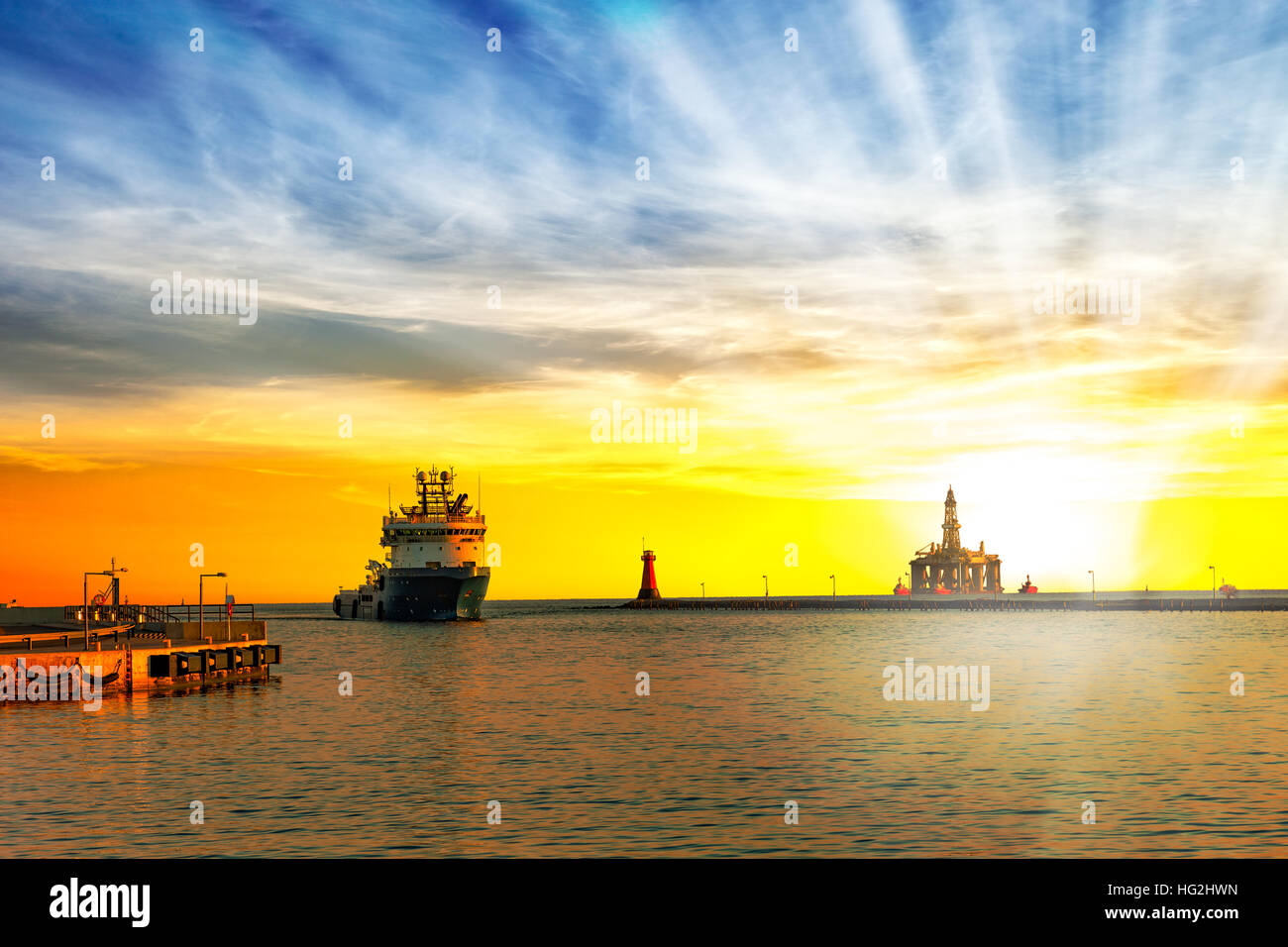 Ship return to port at sunrise. Stock Photo