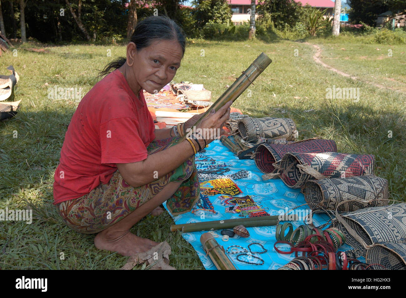 Penn women selling hand made craft along the river bank to Mulu National Park, Borneo. Stock Photo
