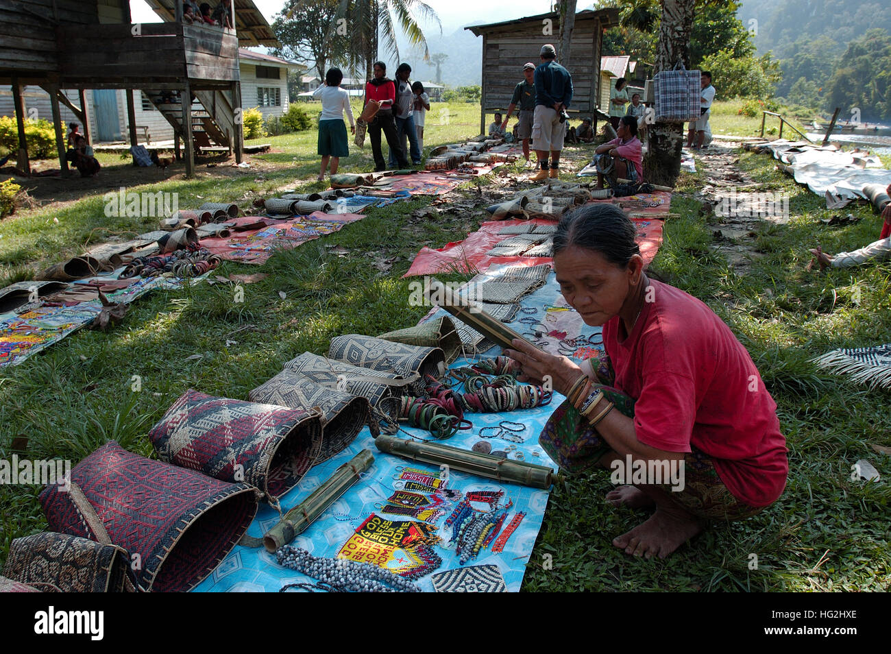 Penn women selling hand made craft along the river bank to Mulu National Park, Borneo. Stock Photo