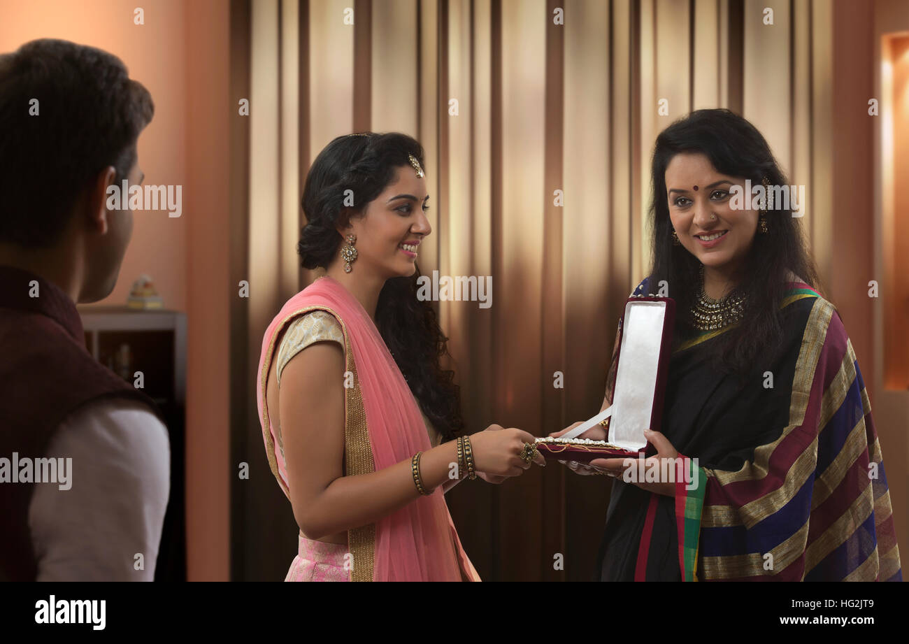 Mother giving jewellery box gift to daughter on diwali Stock Photo