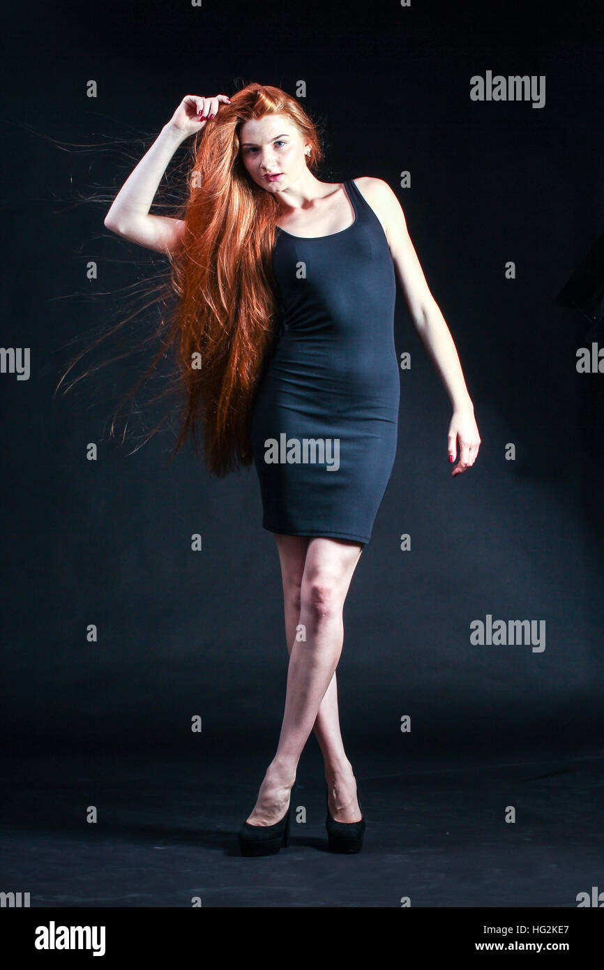 Beauty ginger Girl Portrait. Healthy Long Red Hair. Beautiful Young