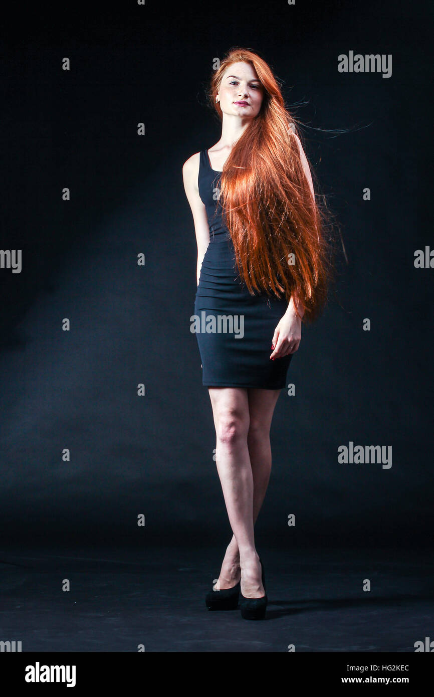 Beauty ginger Girl Portrait. Healthy Long Red Hair. Beautiful Young