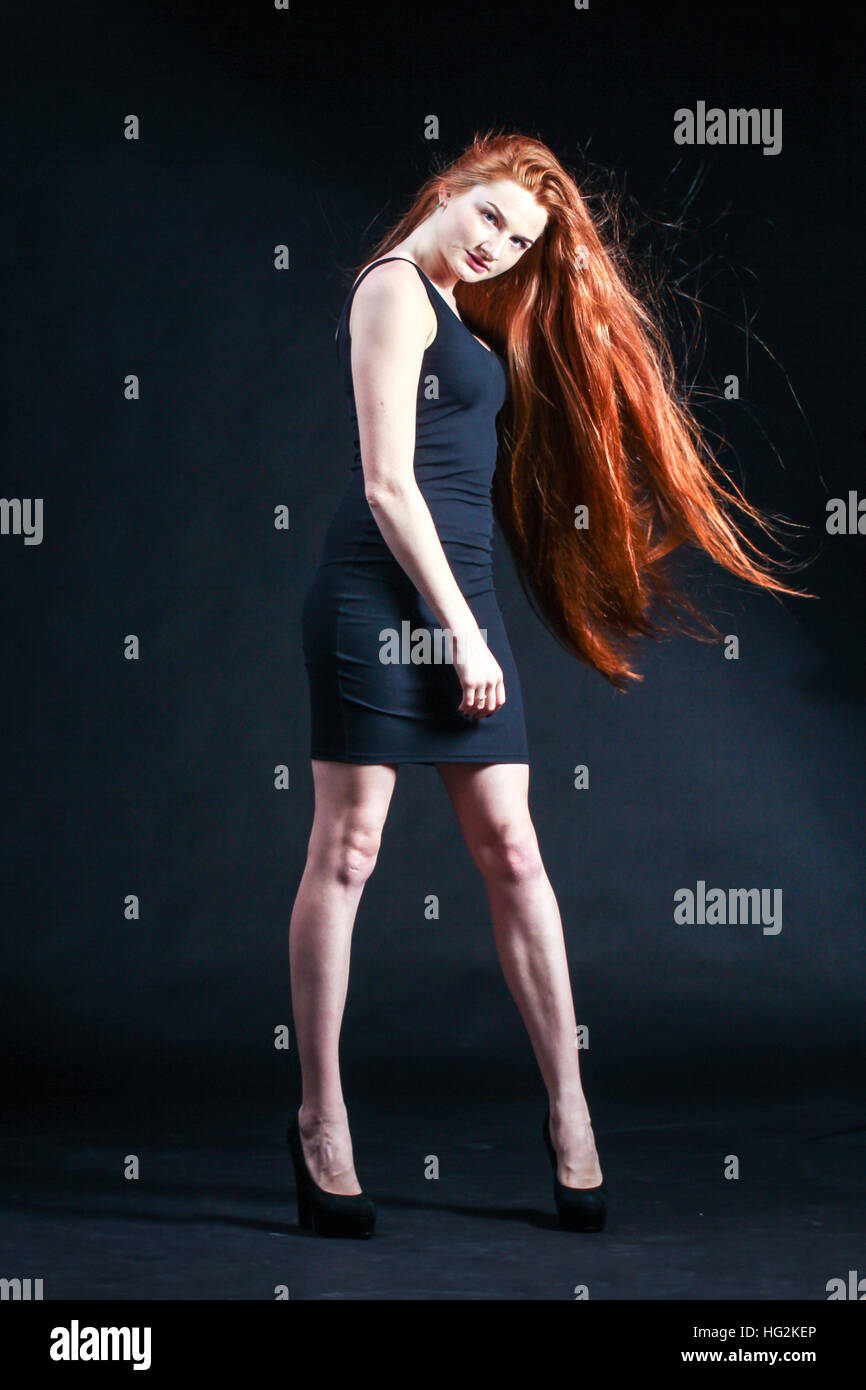 Beauty ginger Girl Portrait. Healthy Long Red Hair. Beautiful Young