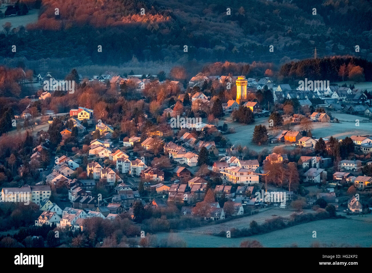 Aerial view, The old water tower in Bommern shines at sunrise, when the rest Bommerns is still in the shadow. , Witten, Stock Photo