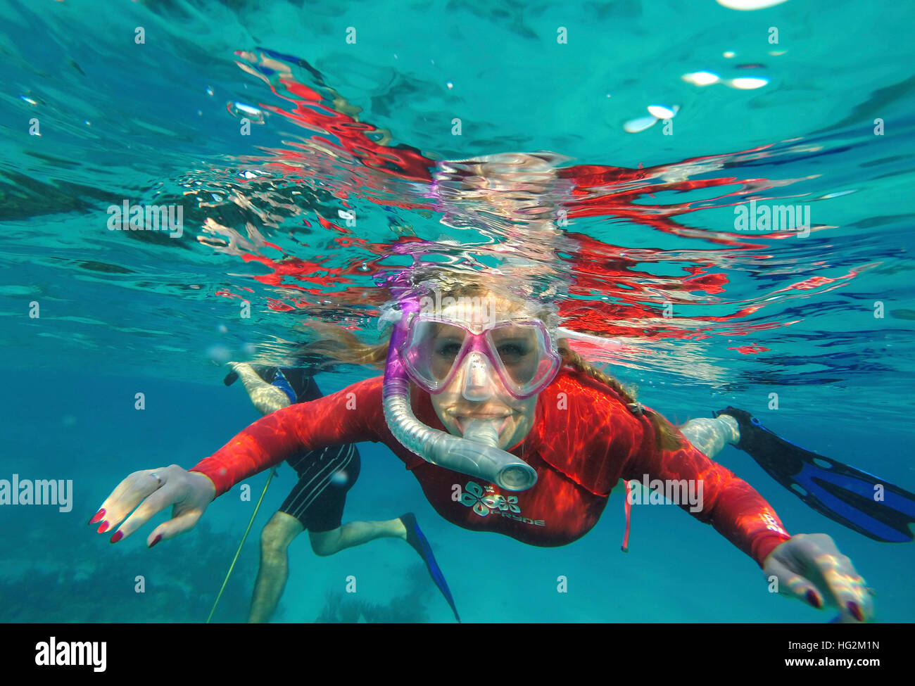 A woman snorkeling in the Bahamas Stock Photo Alamy