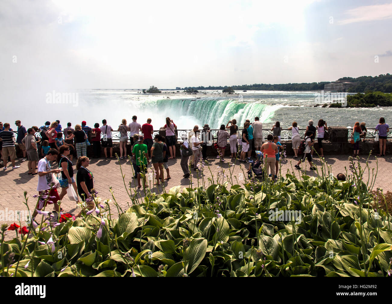 Tourists  on brink of Niagara Falls Stock Photo