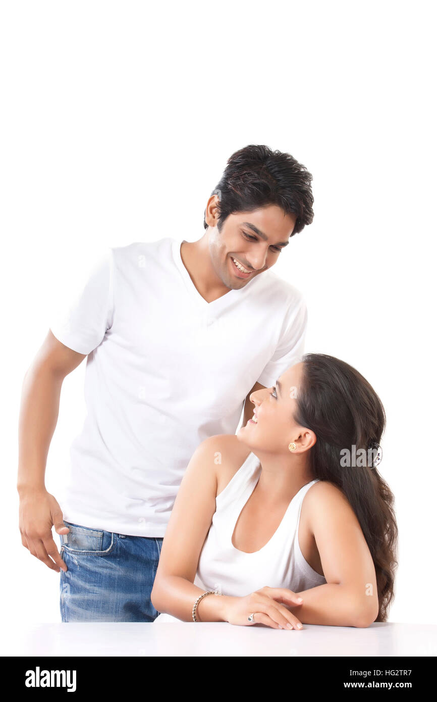 loving couple looking at each other against white background Stock Photo