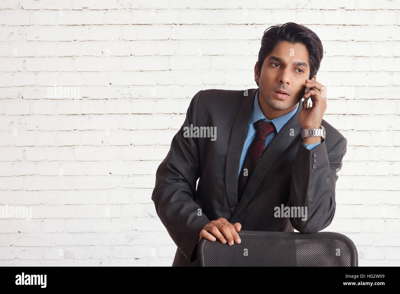 Businessman talking on cell phone Stock Photo