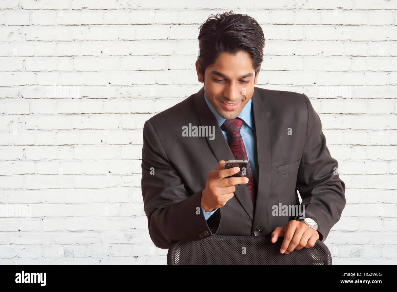 Executive using cell phone Stock Photo