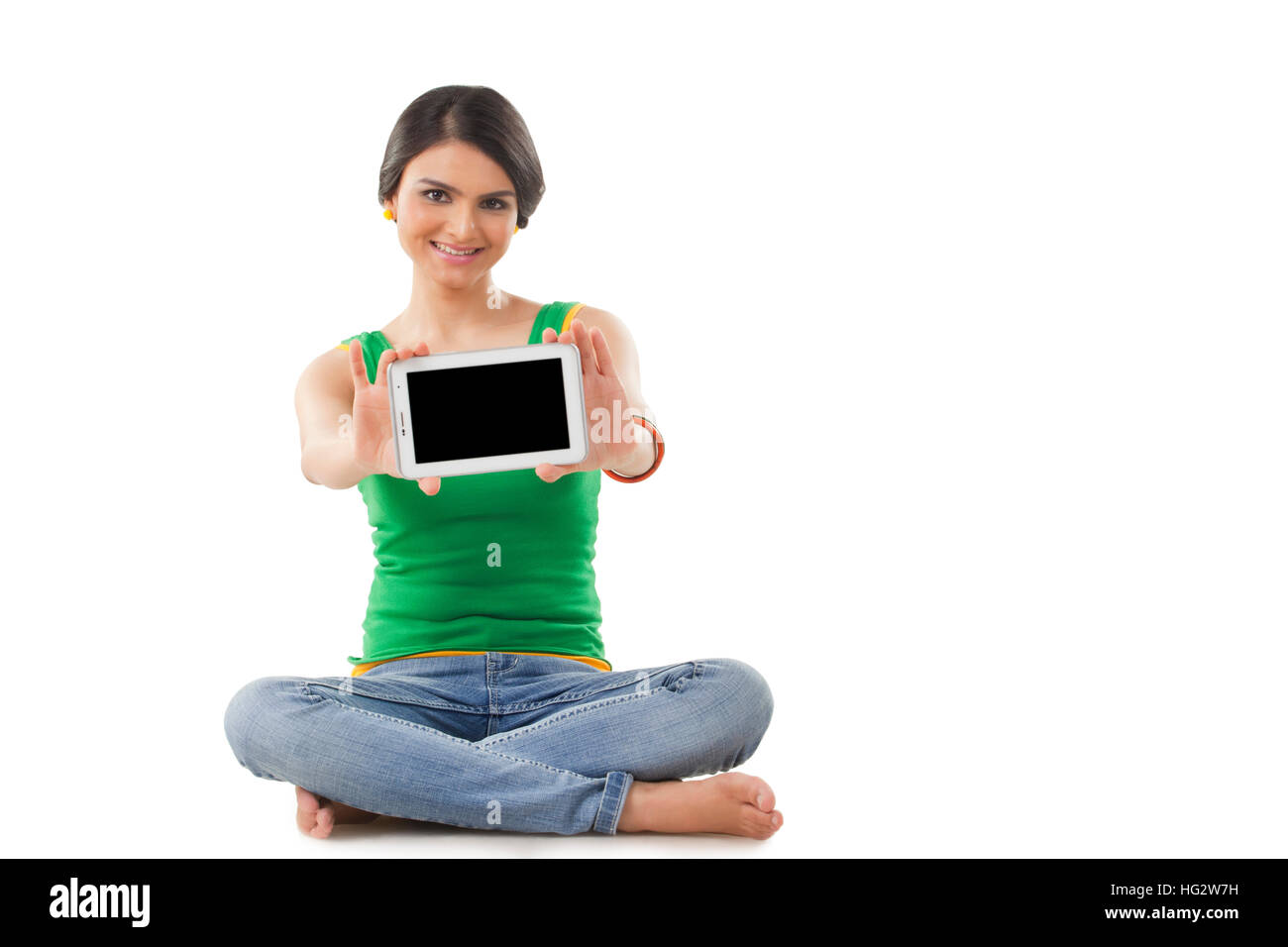 Woman sitting on floor and using digital tablet Stock Photo - Alamy