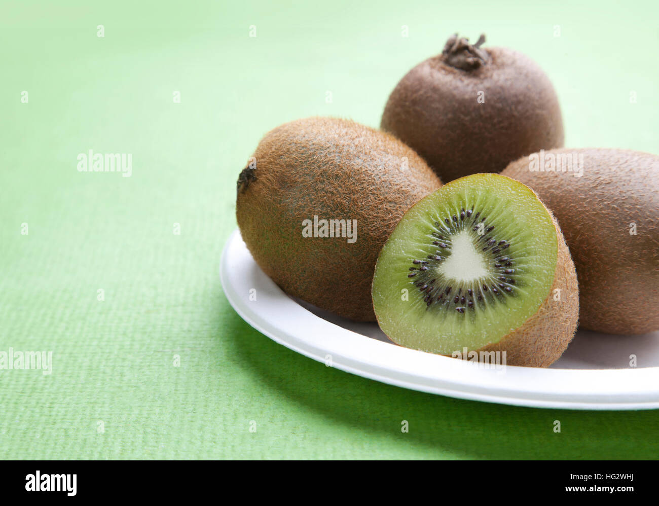 Close-up view of Kiwi fruit on plate Stock Photo