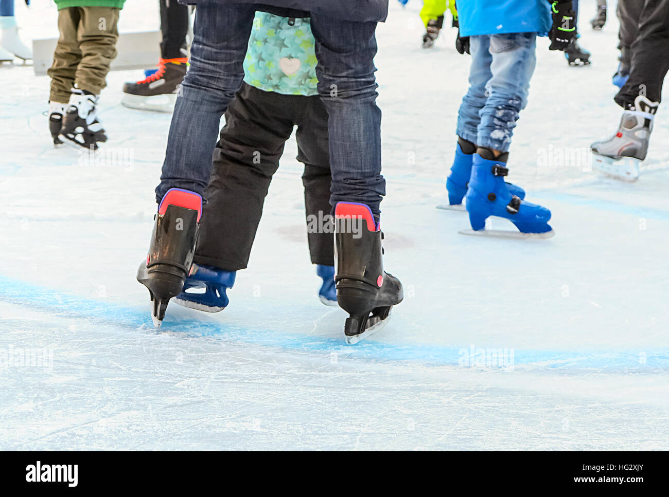 Winter activities fun at the outdoor iceskating rink Stock Photo Alamy