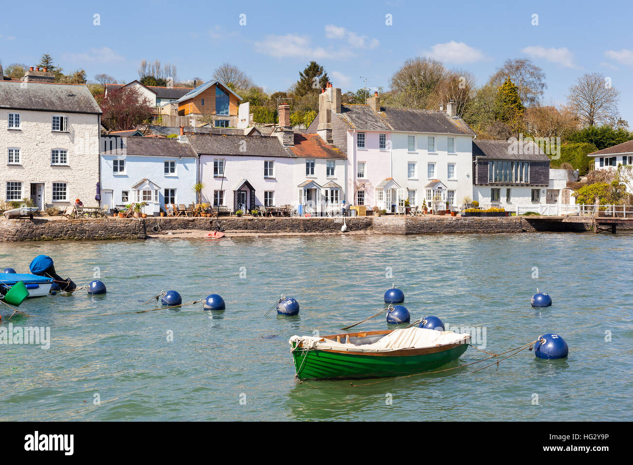 Row of traditional cottages line the edge of the River Dart at Dittisham in South Devon, England Stock Photo