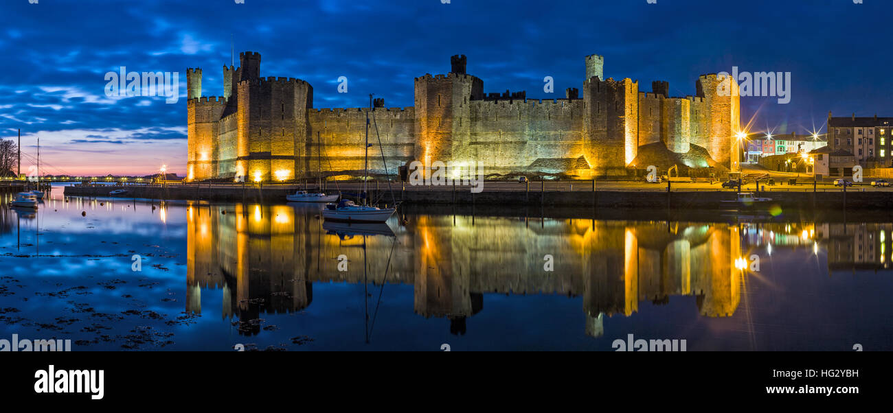 Panoramic View of Caernarfon Castle at Night Stock Photo