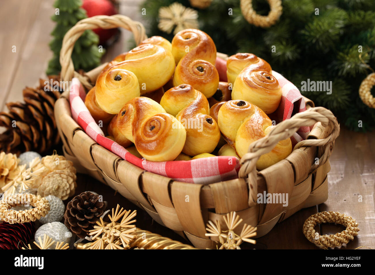 homemade swedish saffron buns, lussekatt in basket Stock Photo