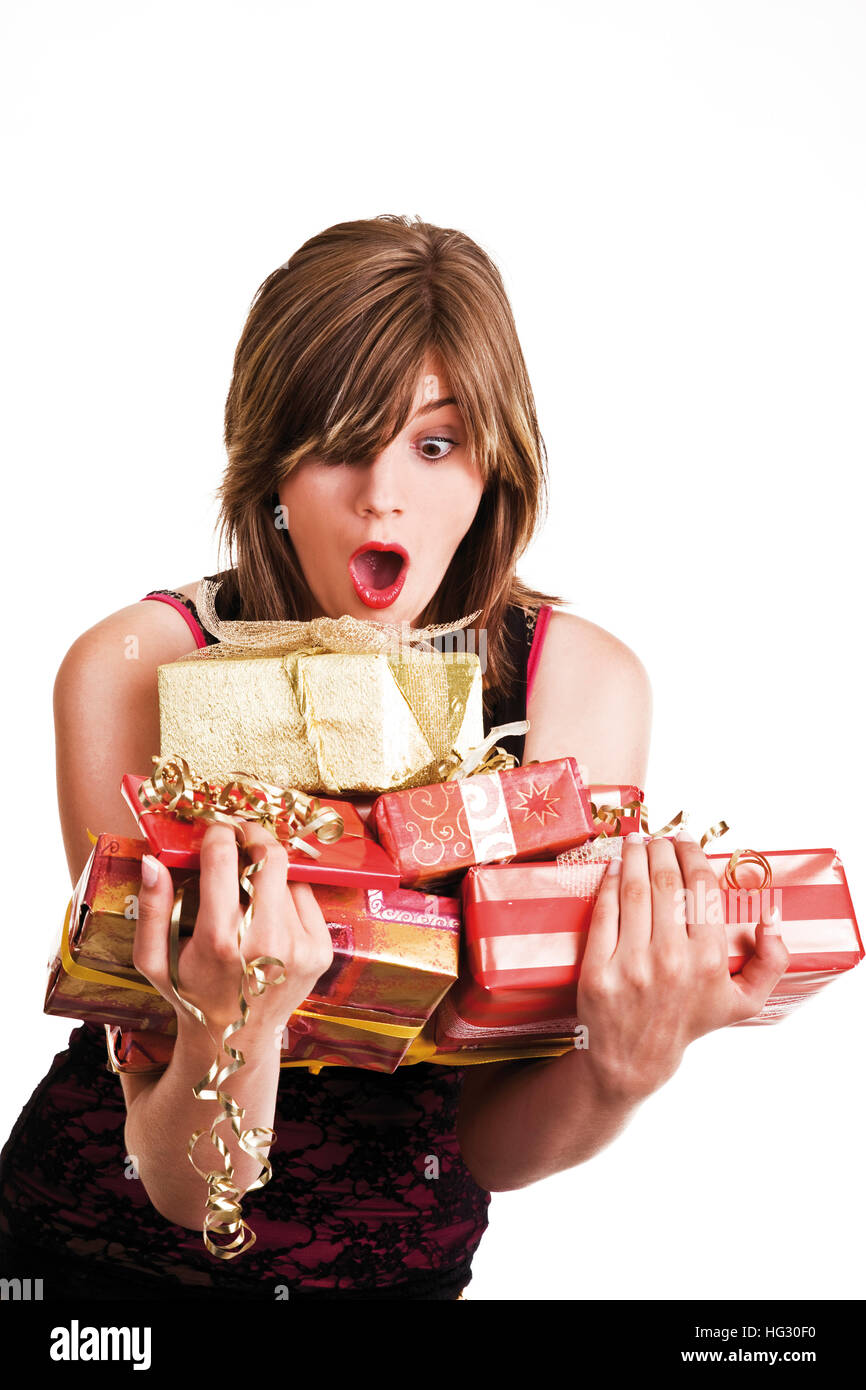 Young woman holding wrapped presents in her arms Stock Photo