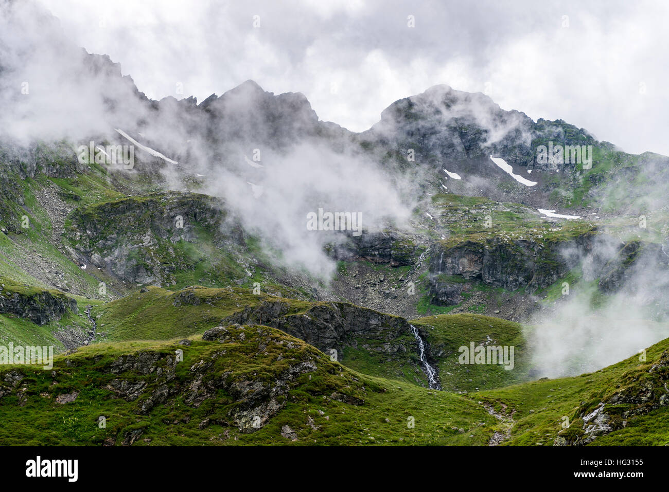 Clouds passing over a mountain ridge, Rohrmoos-Untertal, Schladming Tauern, Styria, Austria Stock Photo