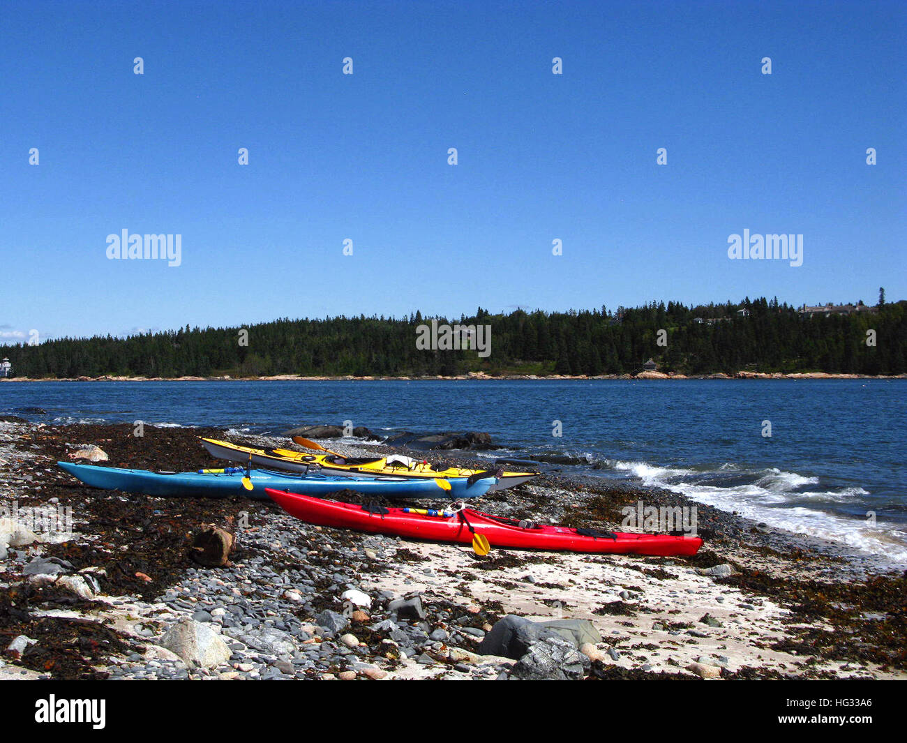 Acadia National Park, Schoodic Peninsula. Sea kayaks on a ledge in the middle of Frenchman's Bay, Winter Harbor, Maine Stock Photo