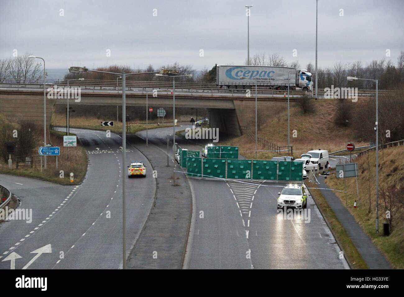 A silver Audi is almost totally hidden by screens at the scene near junction J24 of the M62 in Huddersfield where a man died in a police shooting during a 'pre-planned' operation at around 6pm on Monday. Stock Photo