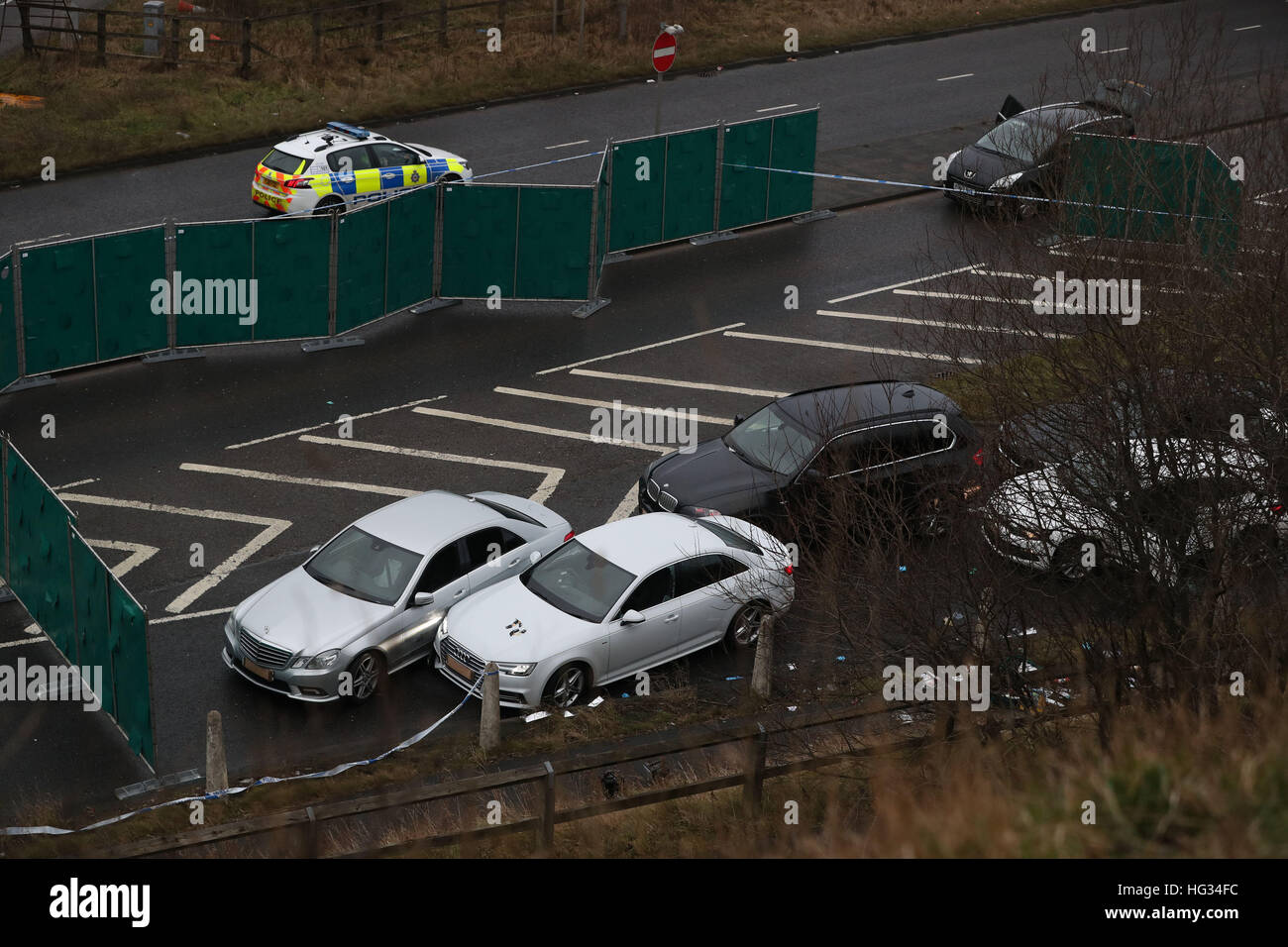 A silver Audi with bullet holes in its windscreen at the scene near junction J24 of the M62 in Huddersfield where a man died in a police shooting during a 'pre-planned' operation at around 6pm on Monday. Stock Photo