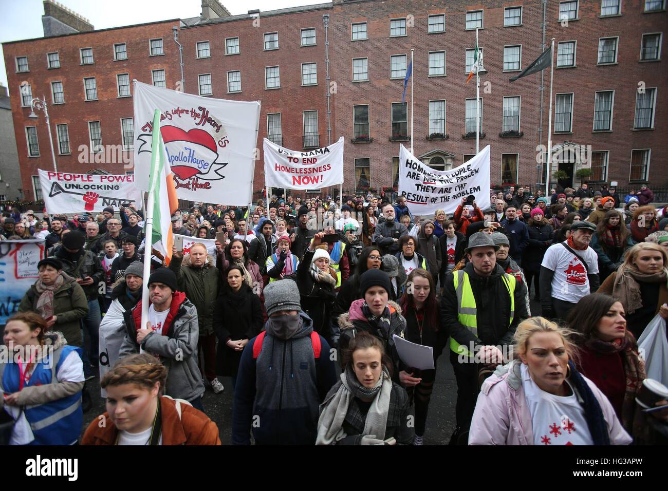 Demonstrators gather outside the Department of Finance, Dublin, where housing activists handed an open letter to Finance Minister Michael Noonan, calling on him to order the use of vacant, state-controlled properties to house the homeless. Stock Photo