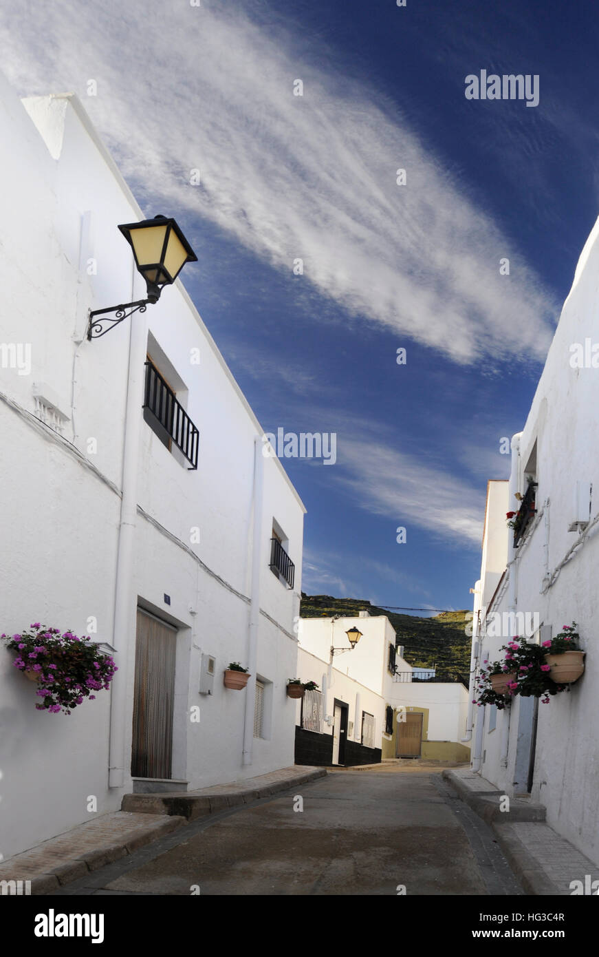 Alley of Andalusian village under the blue sky Stock Photo