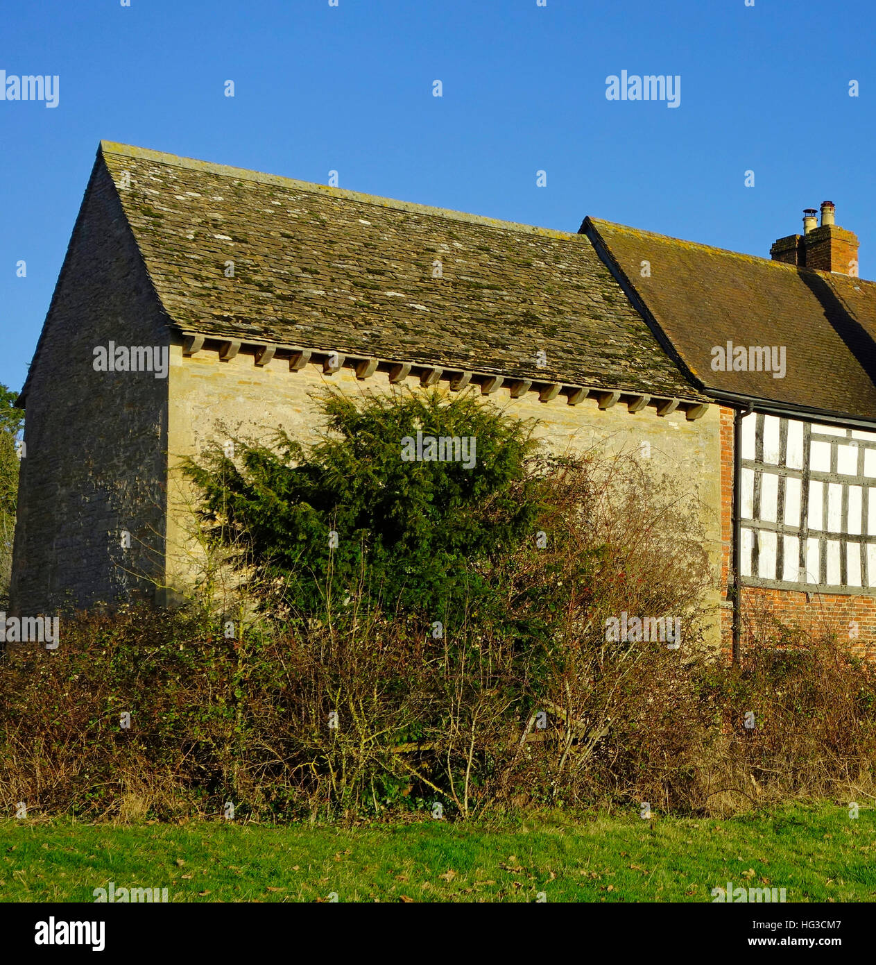Odda's Chapel ( on the left ) with Timber Framed Dwelling, Deerhurst, Gloucestershire, England