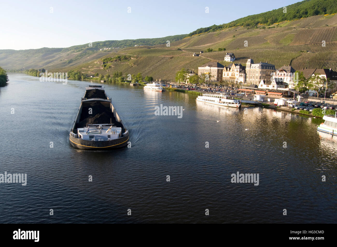A barge carrying coal along the Moselle river in Germany Stock Photo