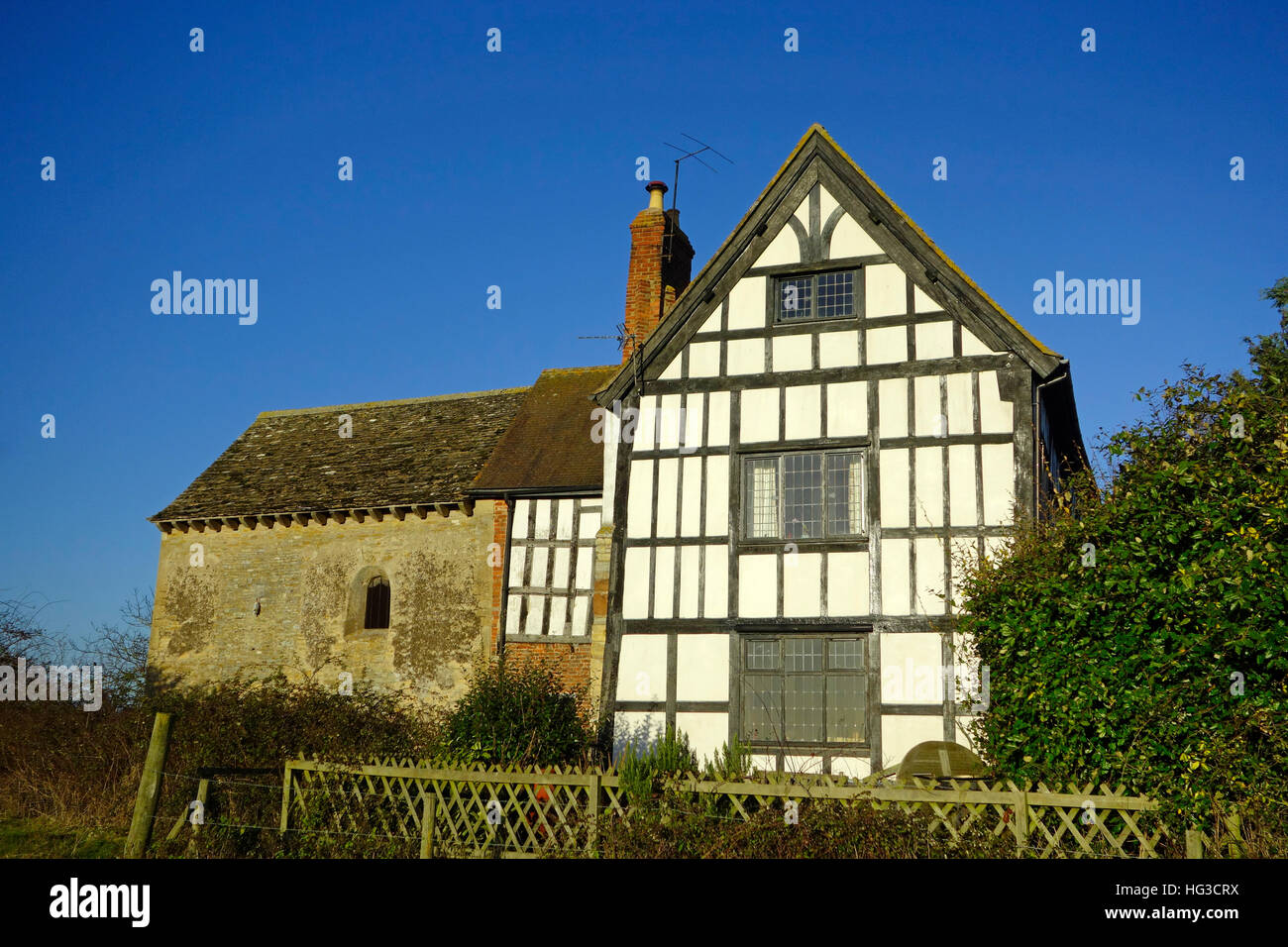 Odda's Chapel ( on the left ) with Timber Framed Dwelling, Deerhurst, Gloucestershire, England
