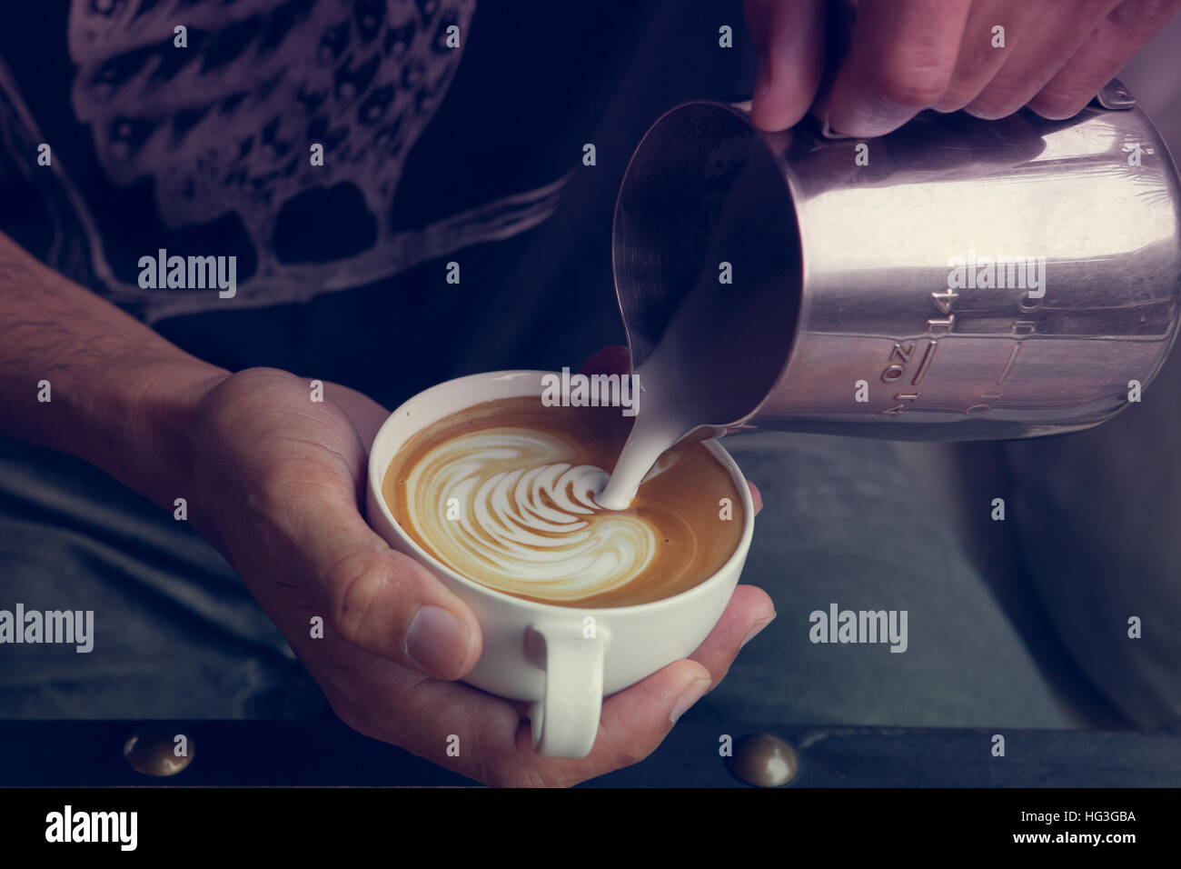 Making coffee latte art  ' Rosetta ' , Vintage tone color Stock Photo